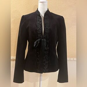 Vintage embroidered black velvet blazer with a tie front. 100% cotton. Size 4